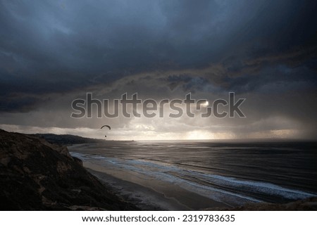 Torrey Pines CA paragliders before the storm on the coast Royalty-Free Stock Photo #2319783635