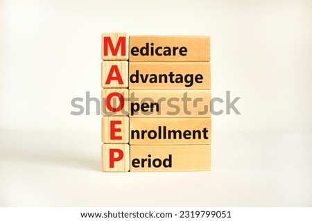 MAOEP symbol. Concept words MAOEP medicare advantage open enrollment period on wooden block. Beautiful white background. Medical MAOEP medicare advantage open enrollment period concept. Copy space. Royalty-Free Stock Photo #2319799051