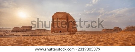 Tomb Lihyan Son of Kuza or Qasr al-Farid at Hegra, Saudia Arabia - most popular landmark in Mada'in Salih archaeological site, sandy desert landscape, morning sun background - high resolution panorama Royalty-Free Stock Photo #2319805379