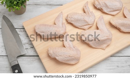 Fresh raw chicken wings.Chicken meat on cutting board.
