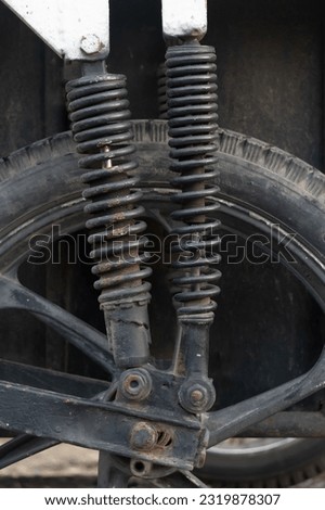 Old motorcycle shock with rust