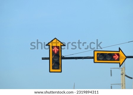 traffic light in red colour on blue sky background