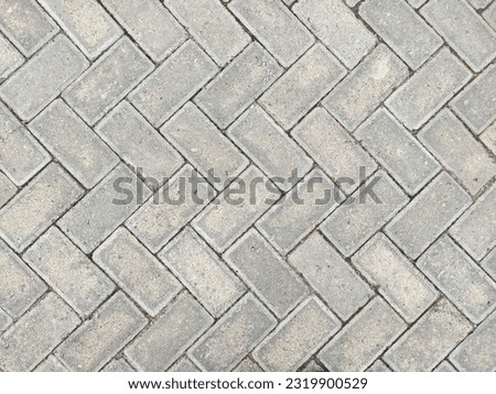 Cement bricks are arranged neatly in the school yard