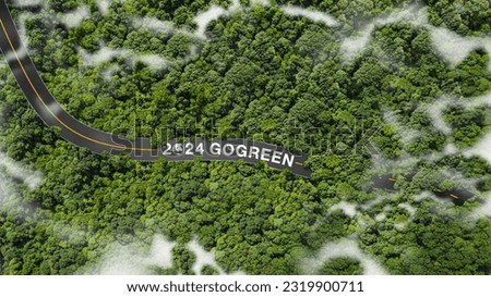 Green business in 2024, the concept of go green, sustainable development of the environment sustainable energy business climate change An aerial shot with the 2024 and "GO Green" on the road. Royalty-Free Stock Photo #2319900711