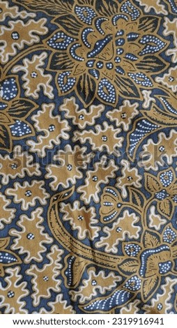 Batik cloth with black and brown leaf motifs is the hallmark of Indonesian batik