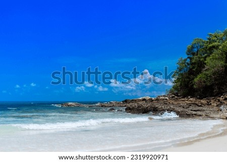White sandy beaches and blue skies and waves are a beautiful sight of the southern seas of Thailand.