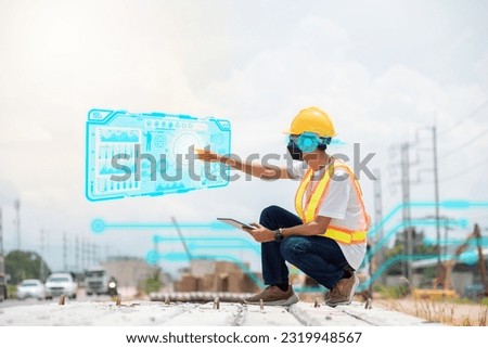 Engineers leverage technology to revolutionize construction sites, streamlining processes, enhancing safety, and boosting efficiency. Royalty-Free Stock Photo #2319948567