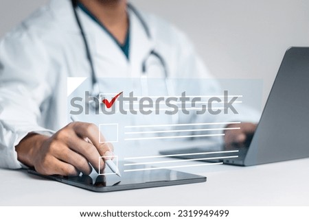 Doctor fills out the medical survey paperwork and checking mark on checkboxes.