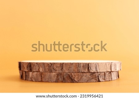 Wooden board over pastel color background. For cosmetics, aesthetics, and objects mockup