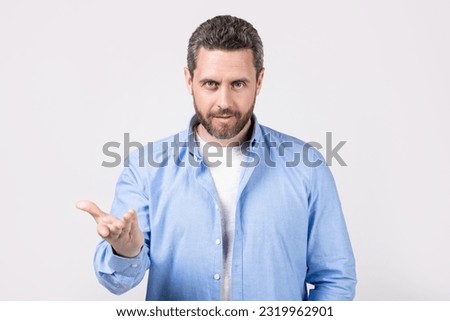 adult gesturing man with nonverbal gesture in studio. man gesturing with nonverbal gesture. man gesturing with nonverbal gesture. man gesturing with nonverbal gesture isolated on grey. Royalty-Free Stock Photo #2319962901