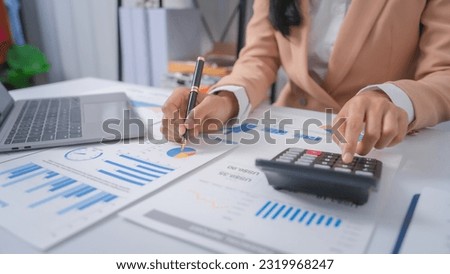 Excited Asian bookkeepers doing bookkeeping, accounts payable, assets, book value, equity, inventory, liabilities, cost of goods sold, depreciation, expenses, Gross profit, diversification, liquidity Royalty-Free Stock Photo #2319968247