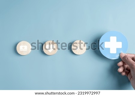 Health insurance concept. people hand holding plus and healthcare medical. health and access to welfare health concept.