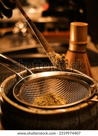 close-up portrait photo ,See how to meticulously make green tea in Japanese style, warm tones