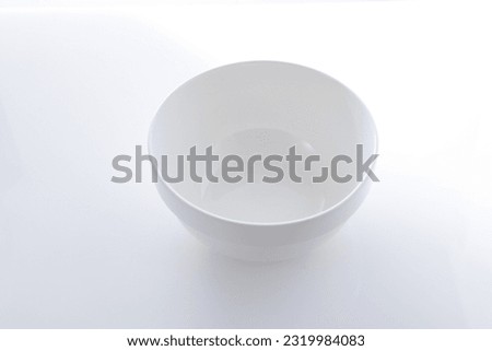 Empty white bowl isolated on white background Royalty-Free Stock Photo #2319984083