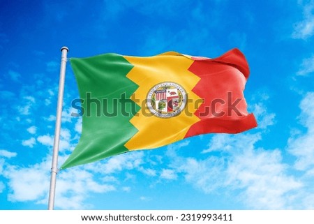 Los Angeles flag waving in the wind, blue sky background