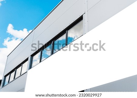 Mockup template. Big horizontal white blank advertising,billboard on modern business building wall outdoors.