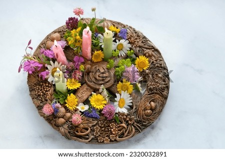 Altar for Summer solstice, Litha wiccan holiday. wheel of the year with colorful flowers and candles close up on abstract marble background. symbol of celtic wiccan sabbat, summer season. top view Royalty-Free Stock Photo #2320032891