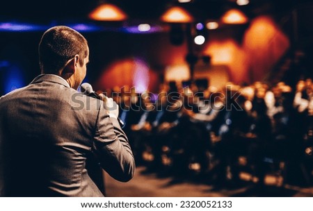Speaker giving a talk on corporate business conference. Unrecognizable people in audience at conference hall. Business and Entrepreneurship event. Royalty-Free Stock Photo #2320052133