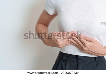 Woman having liver pain. Liver cancer and Tumor, Jaundice, Viral Hepatitis A, B, C, D, E, Cirrhosis, Failure, Enlarged, Hepatic Encephalopathy, Ascites Fluid in Belly and health Royalty-Free Stock Photo #2320070239