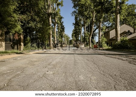 A photo capturing a broken road in Italy undergoing repair and maintenance work.