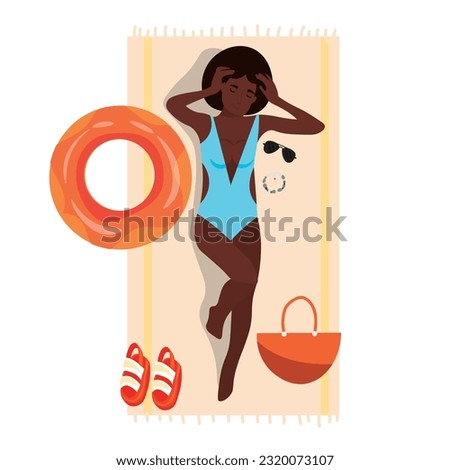 African-American woman lying on beach towel against white backgr