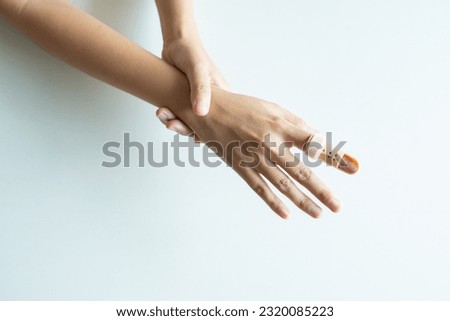 Plastic finger splint on a broken finger support to relieve pain