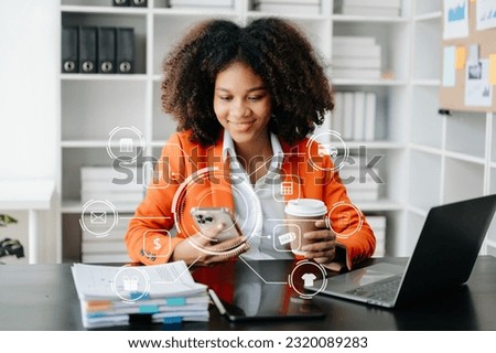  African Woman Hand using tablet ,laptop, and holding mobile phone with credit card online banking payment communication network, internet wireless application virtual icon 
 Royalty-Free Stock Photo #2320089283