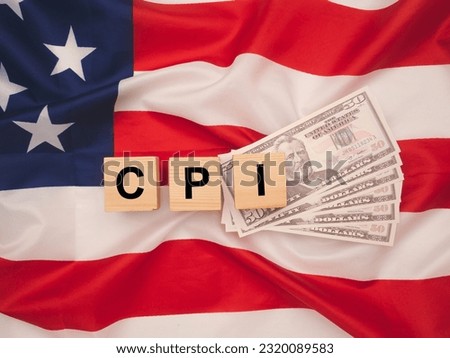 Consumer Price Index concept. Wooden cubes with the letters CPI on the American flag background. Royalty-Free Stock Photo #2320089583