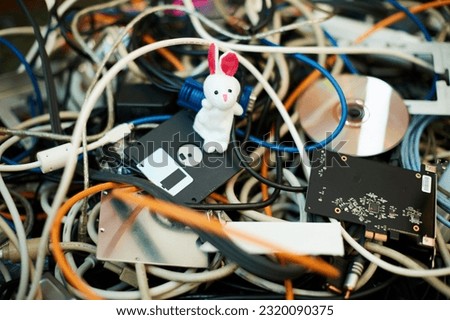 Heap of isolated electrical cable residues. confusion concept with doll