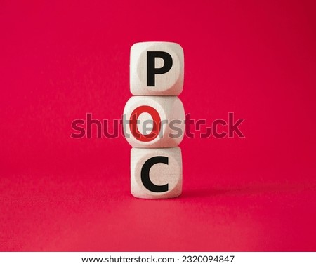 POC - Proof of Concept symbol. Wooden cubes with words POC. Beautiful red background. Business and POC concept. Copy space.