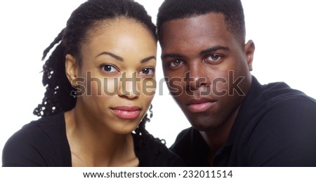 Portrait of serious young black couple looking at camera