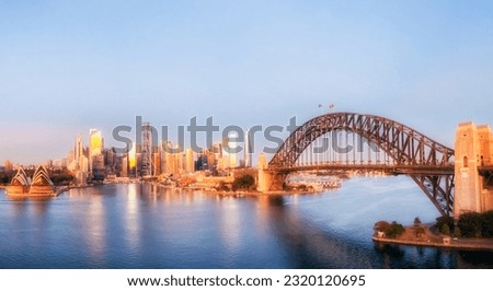 Aerial sunrise panoramic view of Sydney city harbour waterfront major architecture landmarks in Australia.