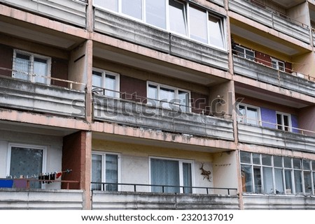 Façade of an ordinary soviet building, a so-called Khrushchevka in Liepāja, Latvia. Low-cost, concrete-paneled or brick three- to five-storied apartment building . Soviet flat Royalty-Free Stock Photo #2320137019