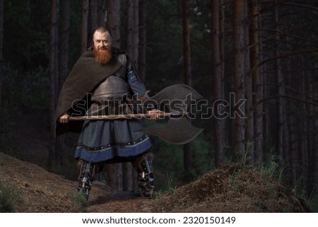 Fantasy medieval red-haired gnome warrior with beard with huge ax halberd in forest.