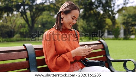 Relax, phone and smile with woman on park bench for social media, streaming and news, Internet, technology and digital with business female in outdoors for communication, commute and networking Royalty-Free Stock Photo #2320161285