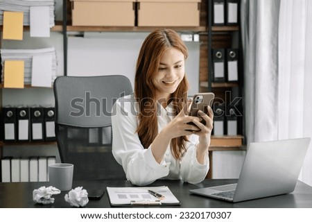 woman using mobile phone to chat with friends during free time.