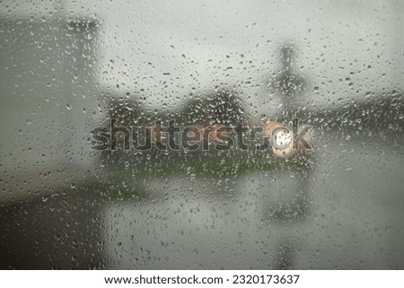 Wet glass. Raindrops on window. It's rainy day. Wet weather.