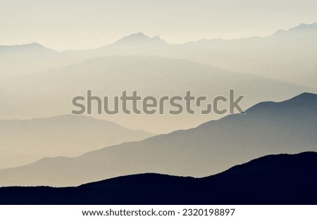 Misty Ridges - Funeral Mountains from Stovepipe Wells Dunes Royalty-Free Stock Photo #2320198897