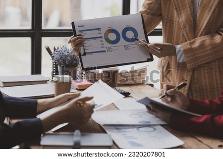 Professionals businesswoman team meeting conference with project planning document analysis and investment decision making at office workplace, Business team brainstorming data target financial.