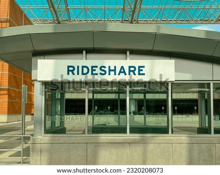 Ride Share Pickup Location at an Airport. A covered structure with the word, "RIDESHARE" on the front of the building. Pickup and drop-off location for those using ride share services.