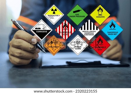 Security officers working with clipboards and inspect the storage of dangerous goods hazard substance on the desktop for operator safety such as explosions, radioactive, toxic gases, etc. Royalty-Free Stock Photo #2320223155