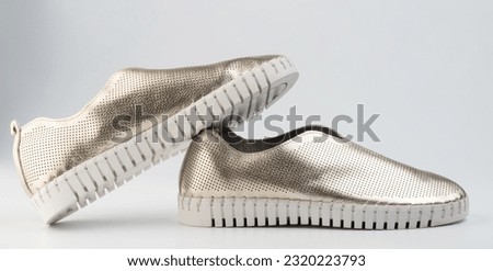 Stylish sparkle shiny casual shoes side view isolated on white studio background