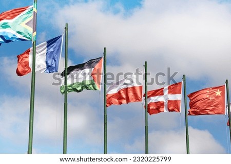 Poland, Denmark, Czech Republic, France, Sudan, South Africa, China flags on blue sky