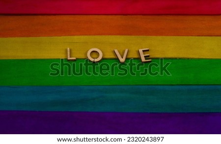 Pride wooden flag - LGBTQ+ community flag with worn out effect with LOVE word 