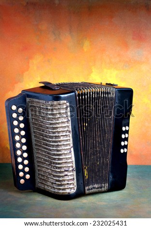 Vintage accordion musical instrument on grunge still life style