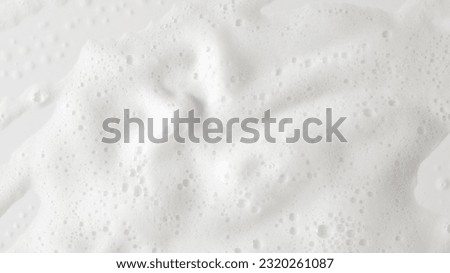 Abstract background white soapy foam texture. Shampoo foam with bubbles Royalty-Free Stock Photo #2320261087