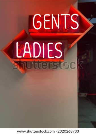 Ladies and Gents Bathroom sign