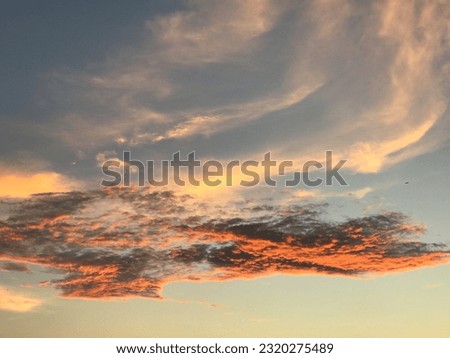 Aerial view dramatic sunset and sunrise sky nature background with white, red, orange and black clouds for design concept and isolated text material.