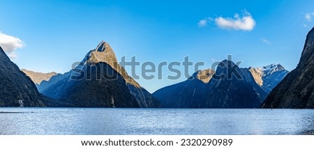 Milford Sound is Fiordland National Park's number one attraction. A cruise will take you through the Fiord to view wildlife and waterfalls.  Royalty-Free Stock Photo #2320290989