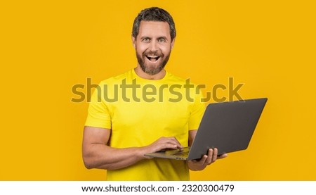 glad man programmer in studio. photo of man programmer with laptop.